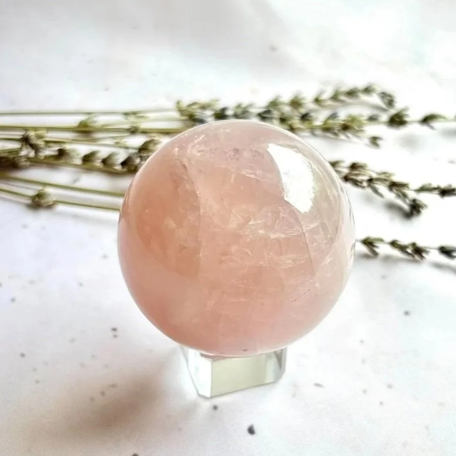 Natural Lavender Rose Quartz crystal sphere with soft lavender-pink colouring
