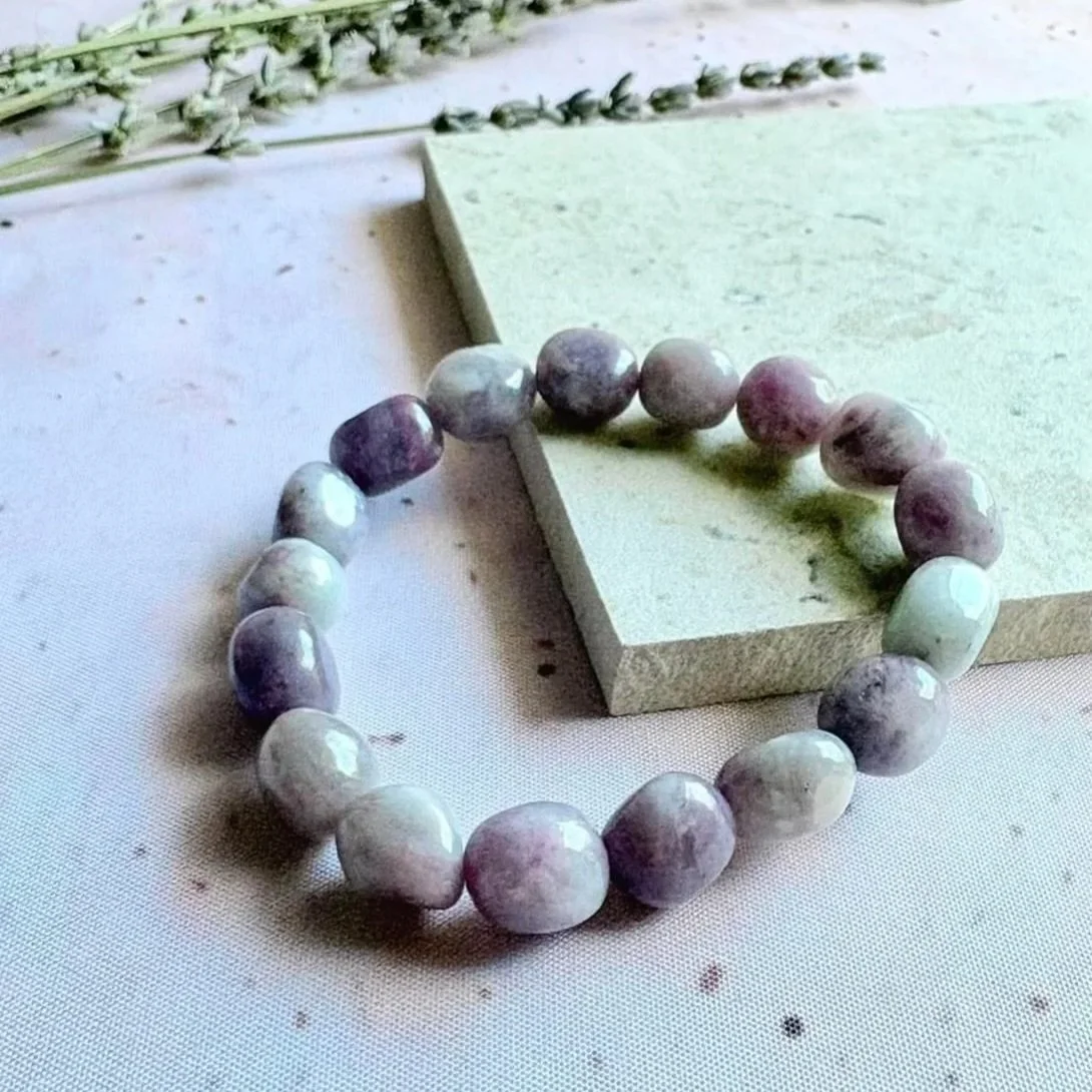 Quartz with Pink Tourmaline bracelet displaying natural pink inclusions and clear crystal beads