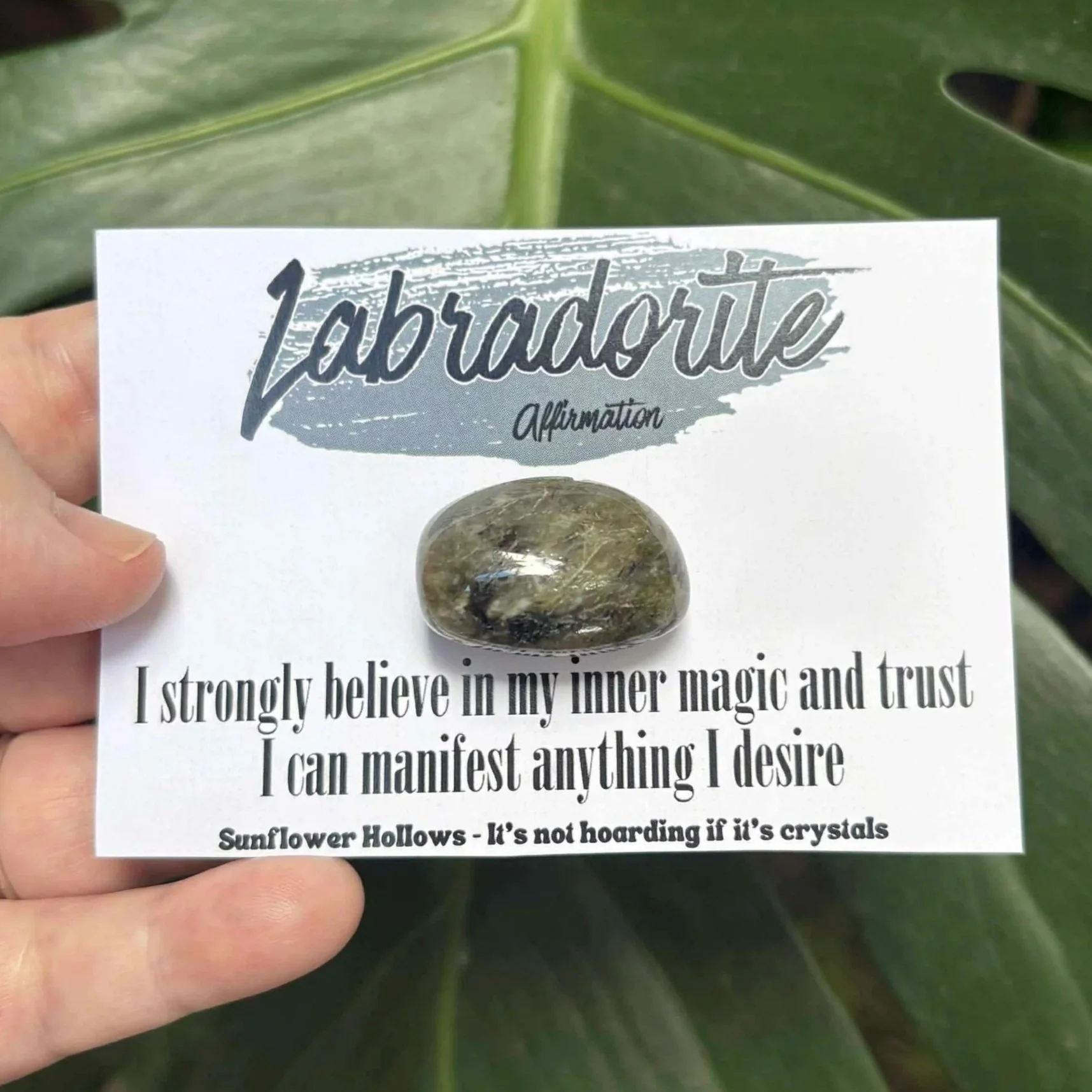 Labradorite crystal paired with affirmation card that reads “I strongly believe in my inner magic and trust I can manifest anything I desire