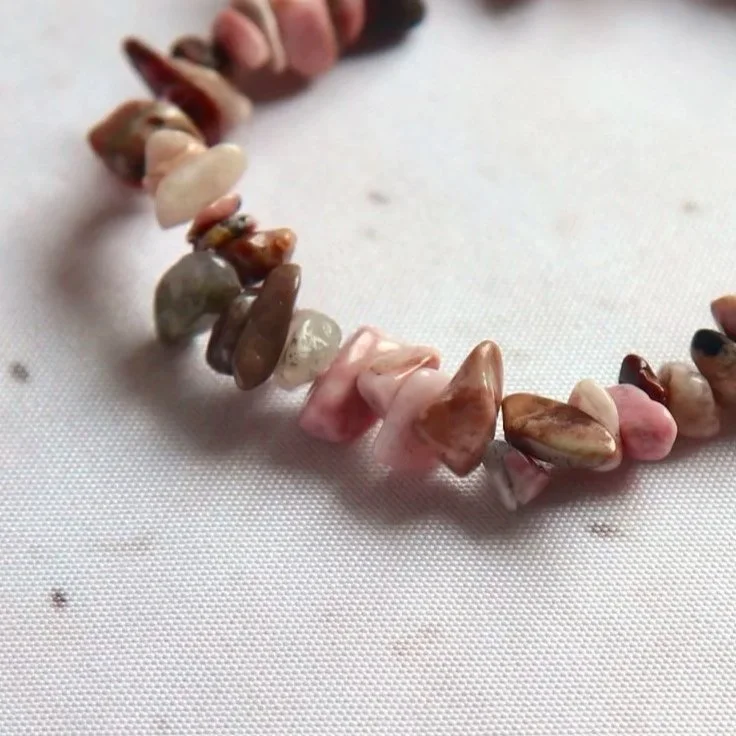 Natural Rhodonite crystal chip bracelet featuring irregular polished stone pieces