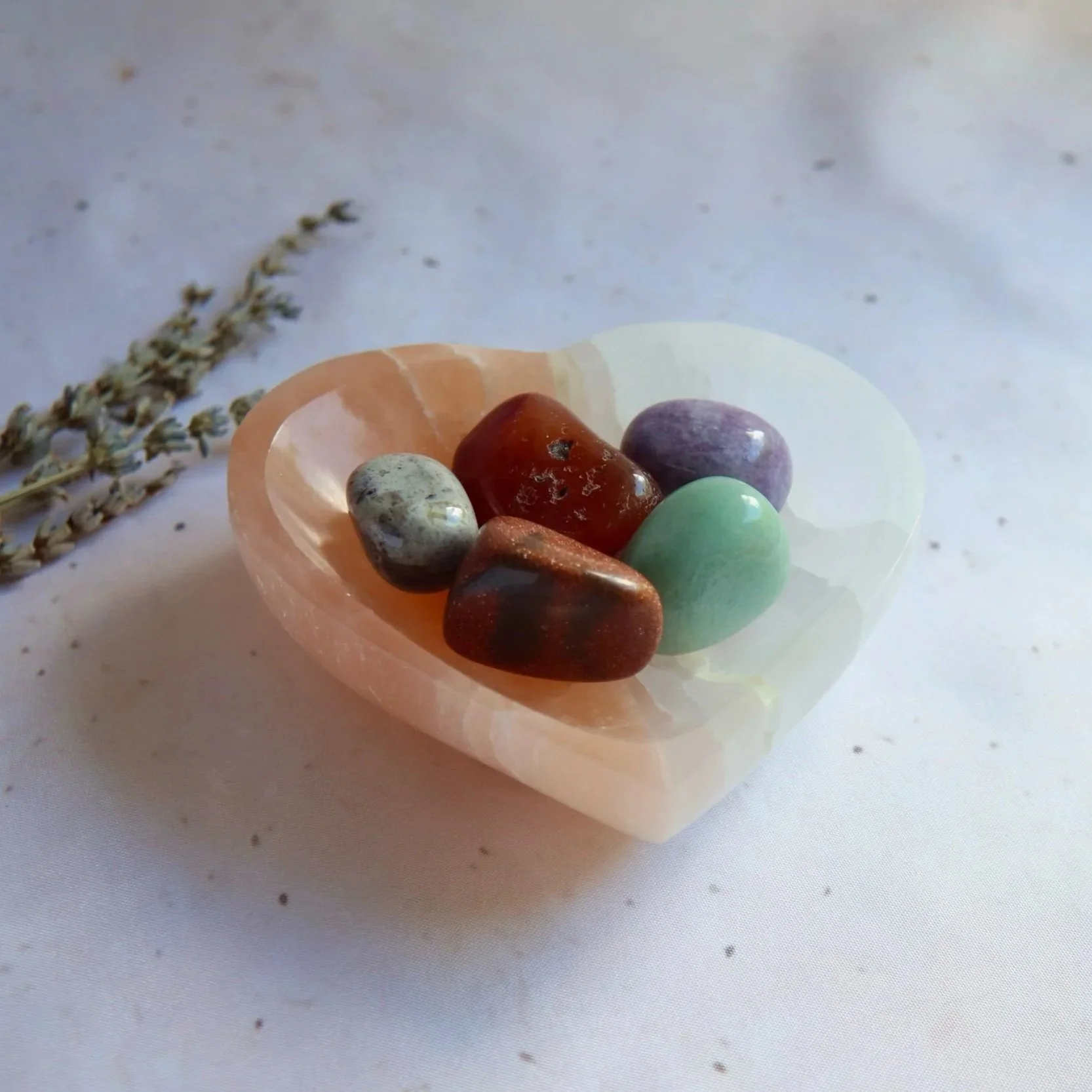 Peach and white Satin Spar crystal heart bowl with yin-yang-inspired contrasting design