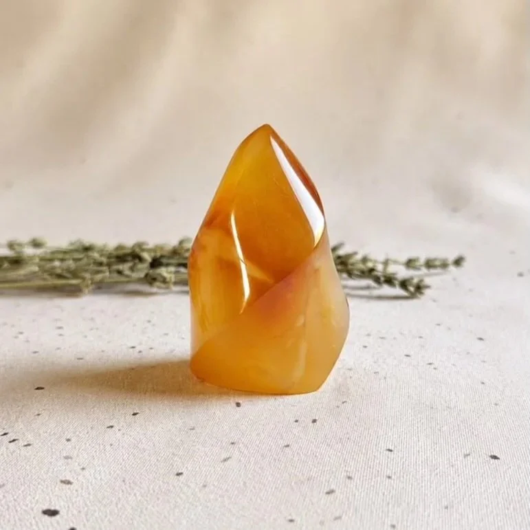 Natural Carnelian flame measuring approximately 6cm tall and 3cm wide