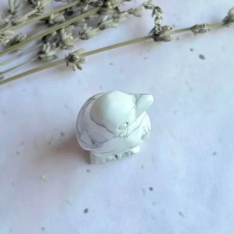 Howlite penguin crystal carving associated with calm, patience, and relaxation