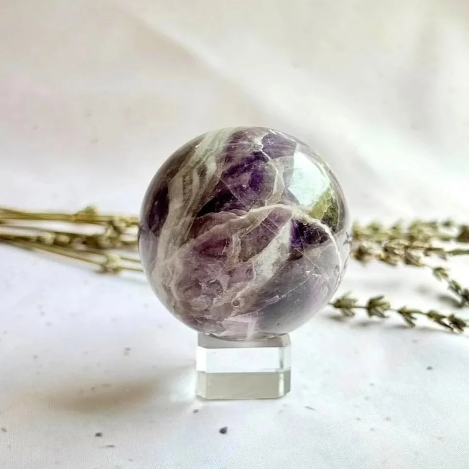 Chevron Amethyst sphere measuring approximately 5.5cm in diameter