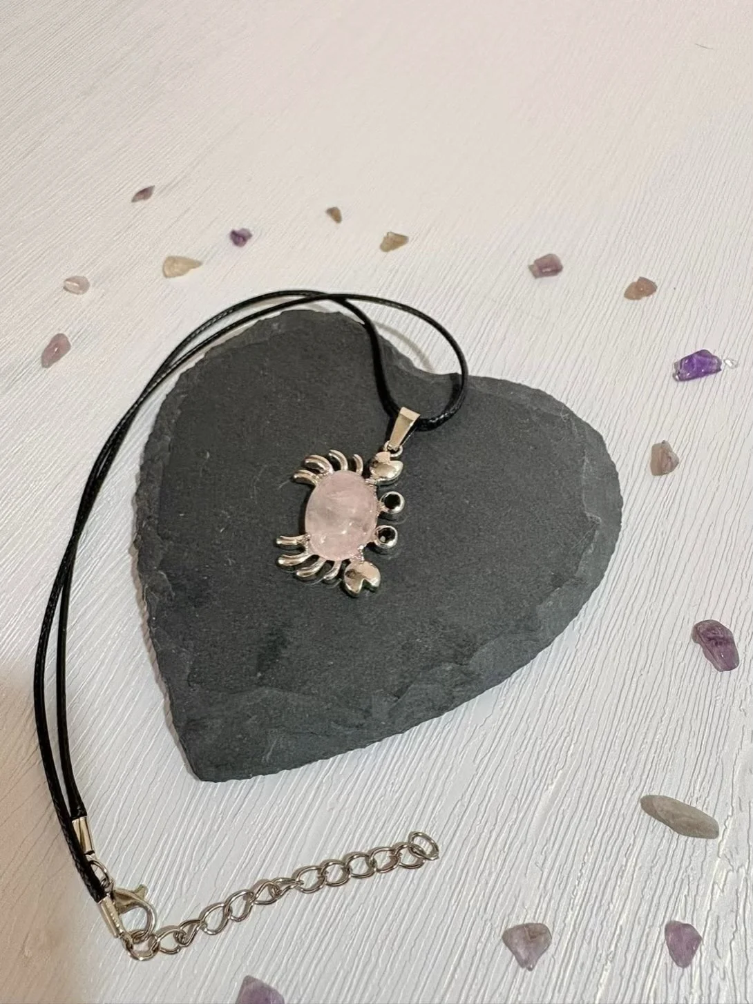 Rose Quartz crab pendant close up showing soft pink tones