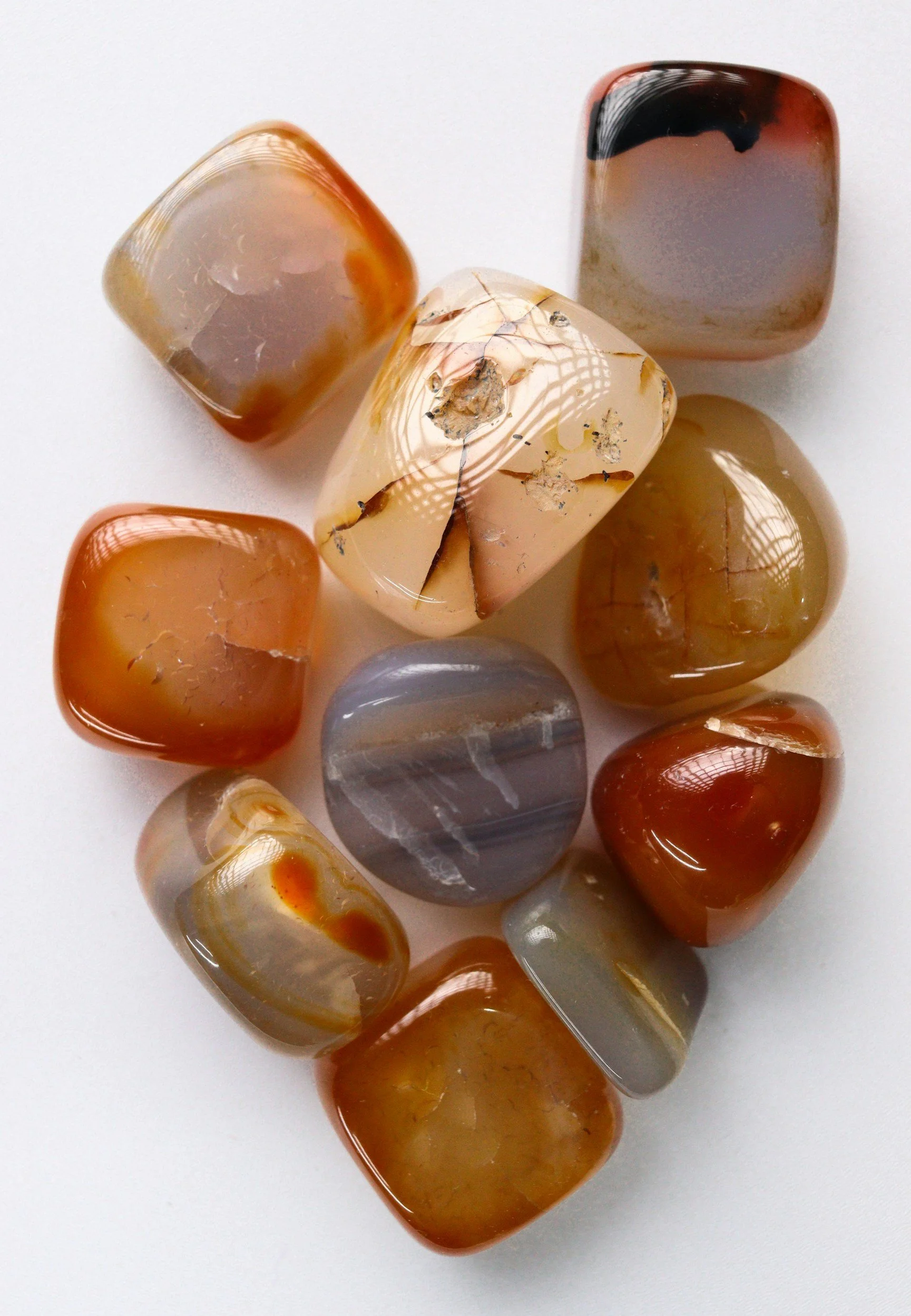 Polished orange and peach crystals, including Carnelian, for the Sacral Chakra