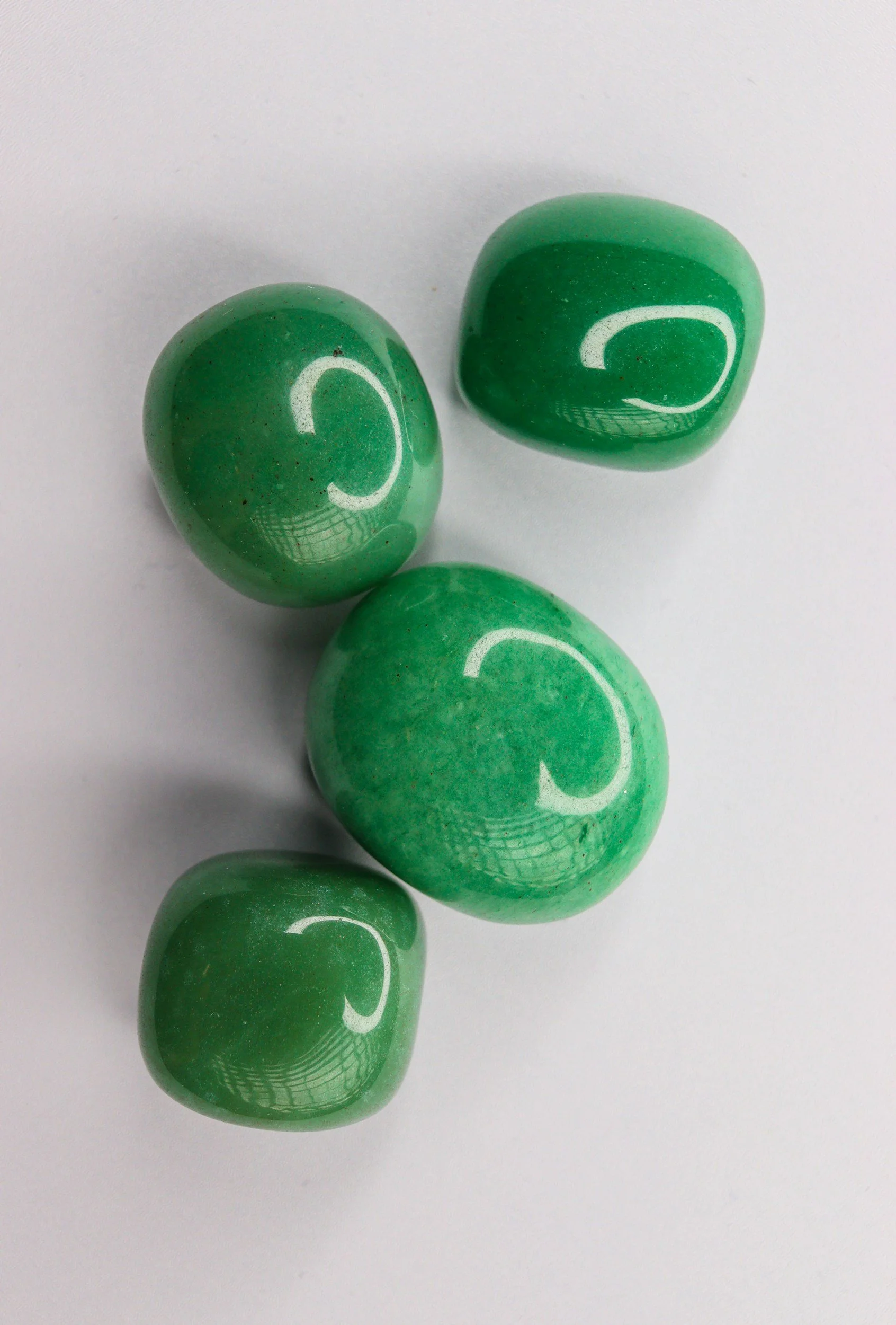Polished Green Aventurine crystals, traditionally associated with the Heart Chakra