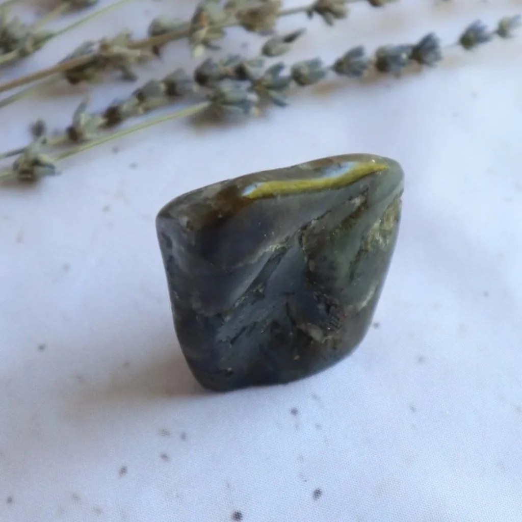 Labradorite freeform crystal displayed to show its polished surface and natural characteristics