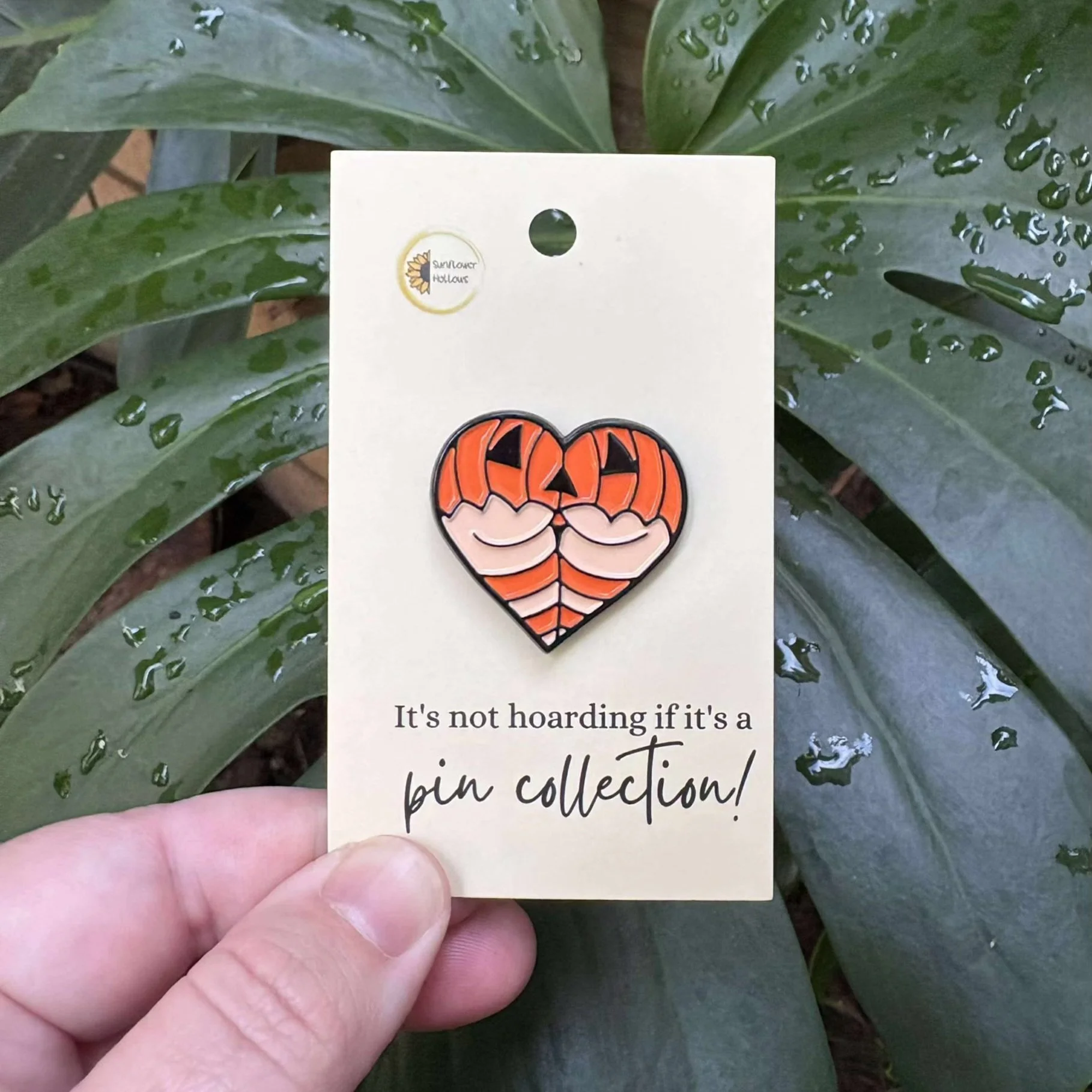 Enamel pin with a heart shape and a sassy bum in pumpkin lingerie, perfect for spooky season style