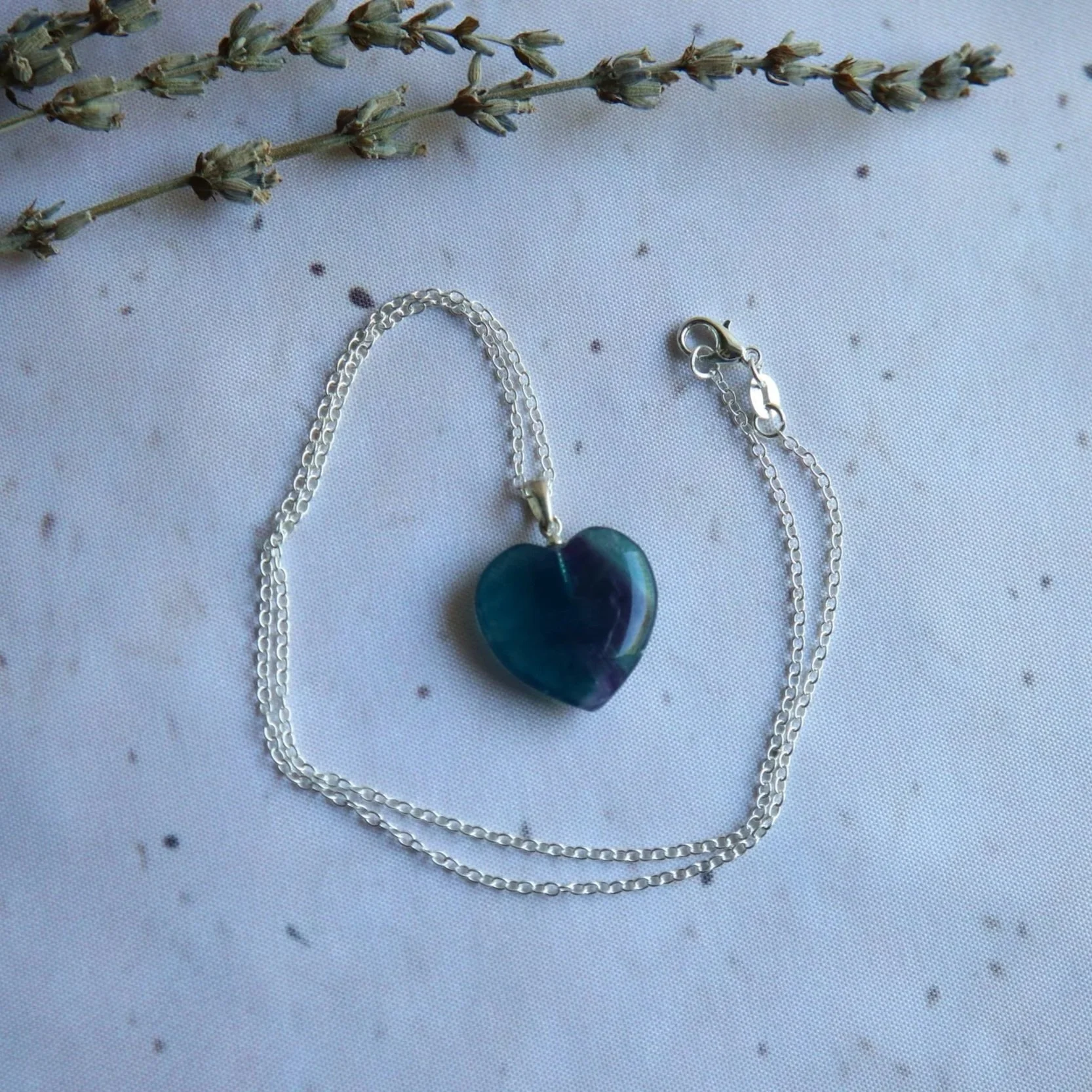 Rainbow Fluorite heart pendant necklace featuring colourful gemstone material and a classic heart-shaped design.