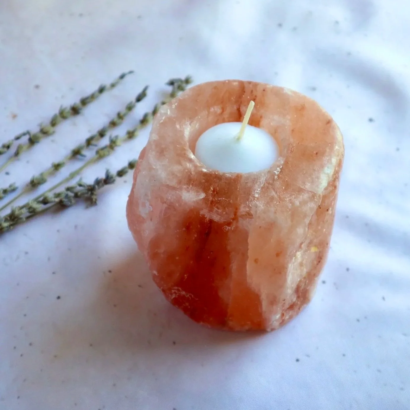 Hand-carved Himalayan Salt candle holder displayed with dried lavender on a neutral backdrop.