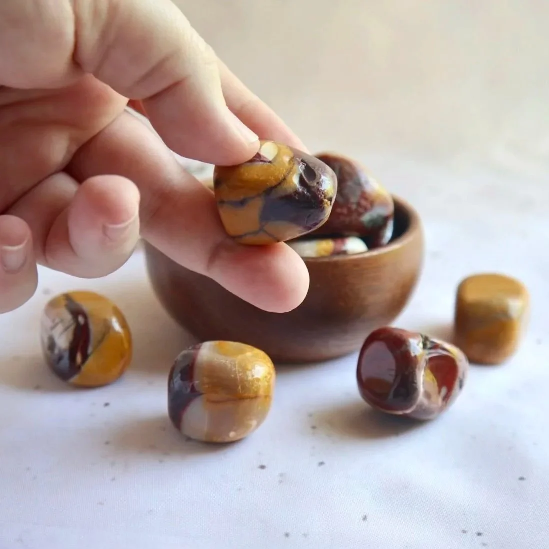 Polished Mookaite tumble with natural red, yellow, cream and brown colouring