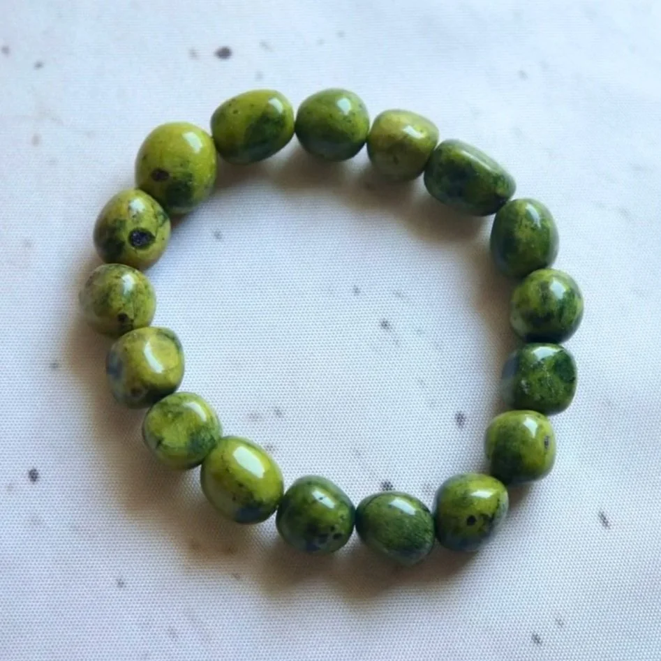 Australian Atlantisite tumble bead bracelet featuring natural green Serpentine and purple Stichtite