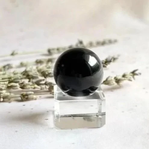 Polished Black Obsidian sphere with deep glossy black colouring