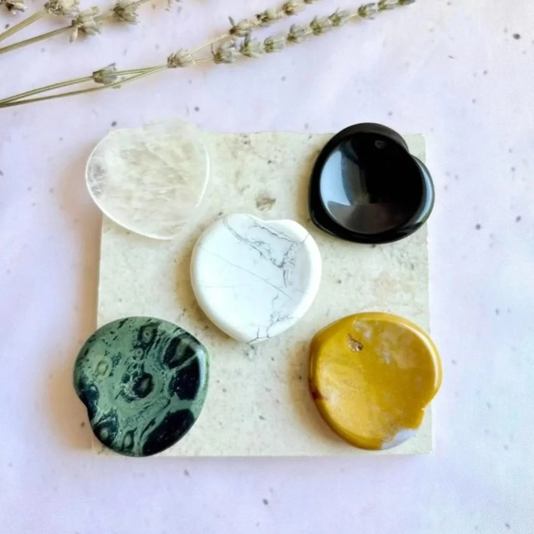 Heart-shaped crystal worry stones measuring approximately 4cm with thumb indentation