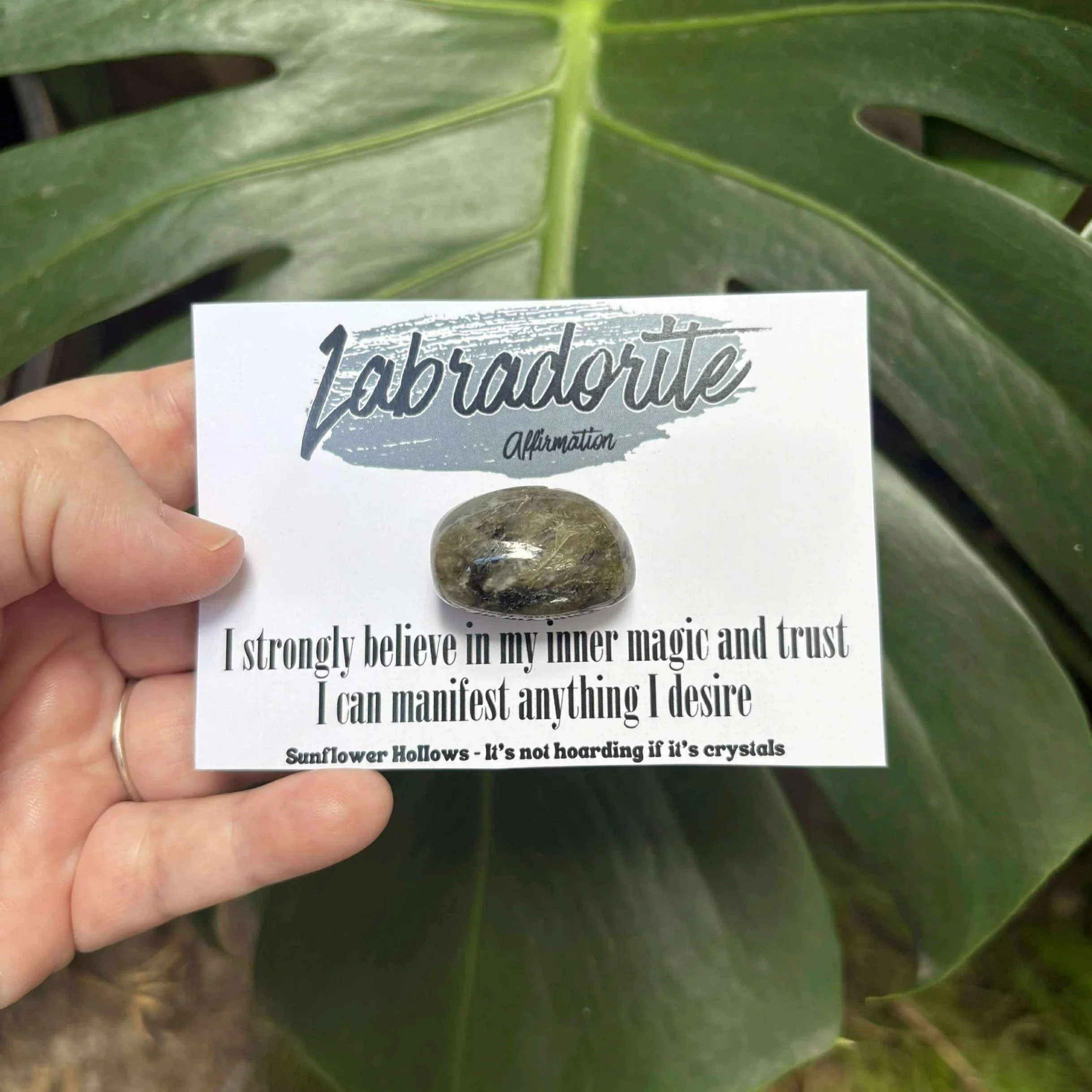 Labradorite crystal paired with affirmation card that reads “I strongly believe in my inner magic and trust I can manifest anything I desire