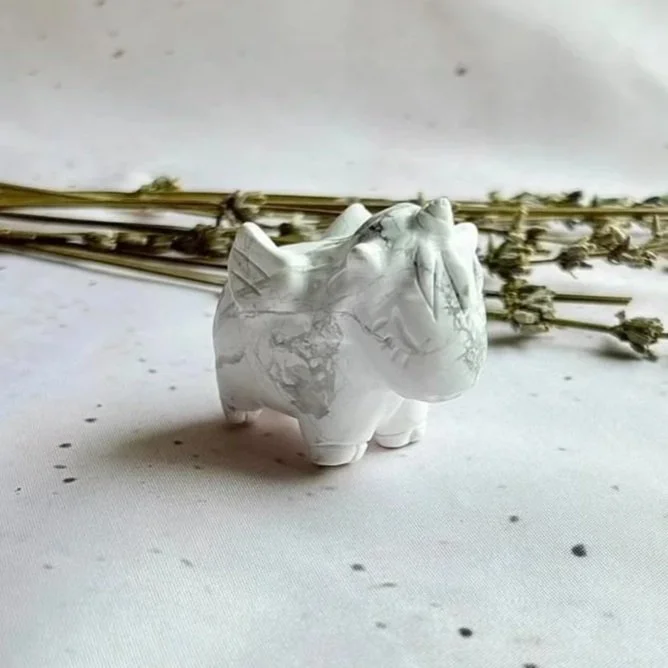Carved Howlite Pegasus with detailed wings and natural grey veining