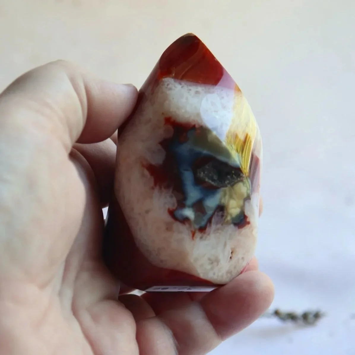 Carnelian Flame being held for scale