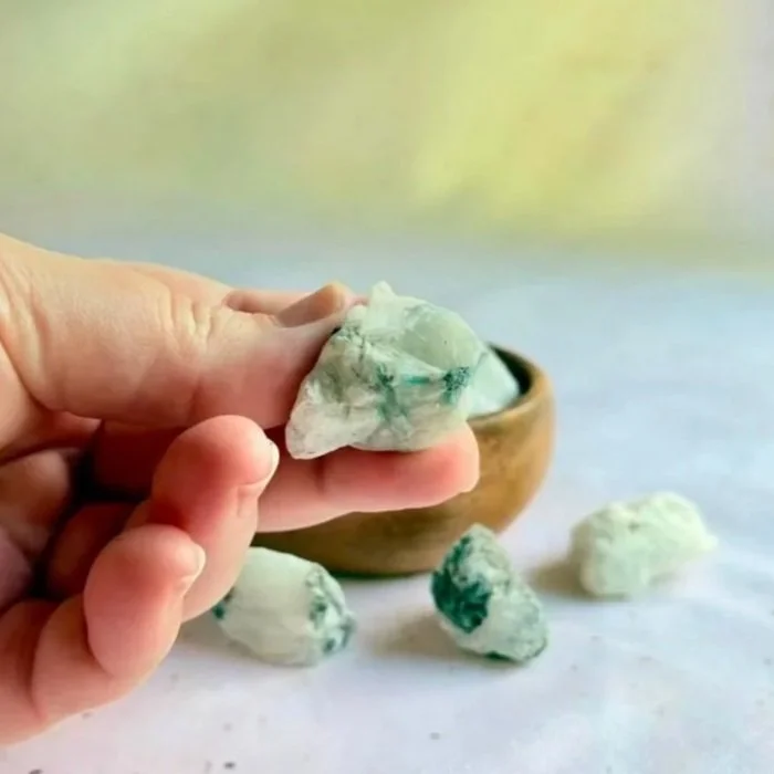Raw Rainbow Moonstone crystal with natural texture and subtle flash