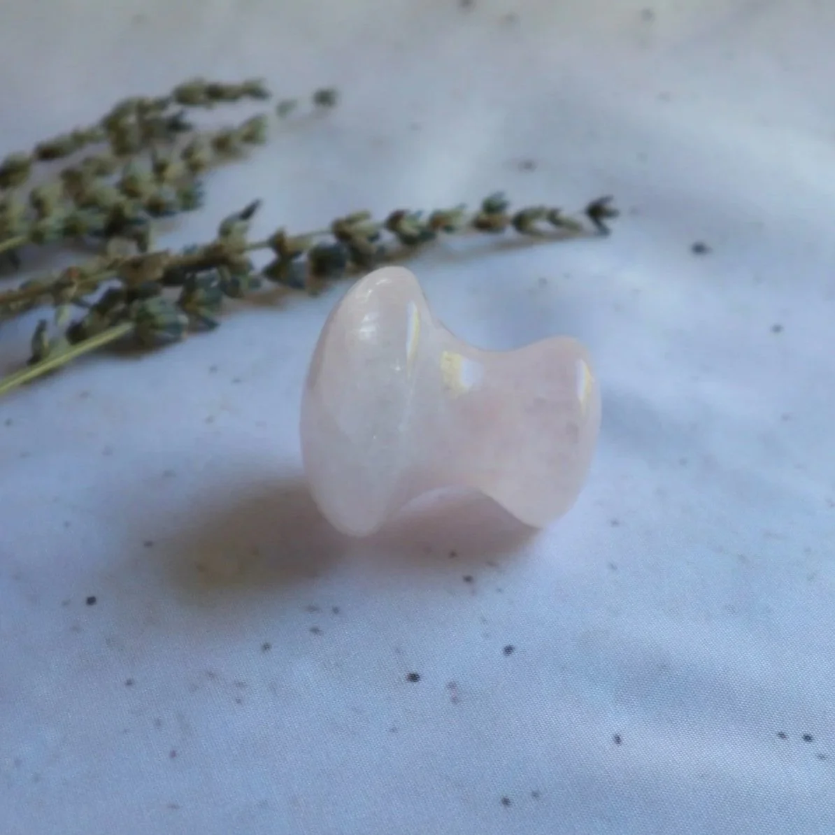 Rose Quartz crystal mushroom massager with smooth polished finish