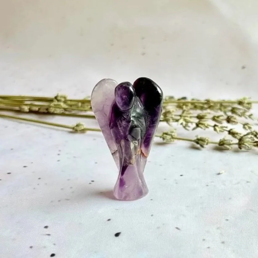Polished Amethyst crystal angel with natural purple colouring