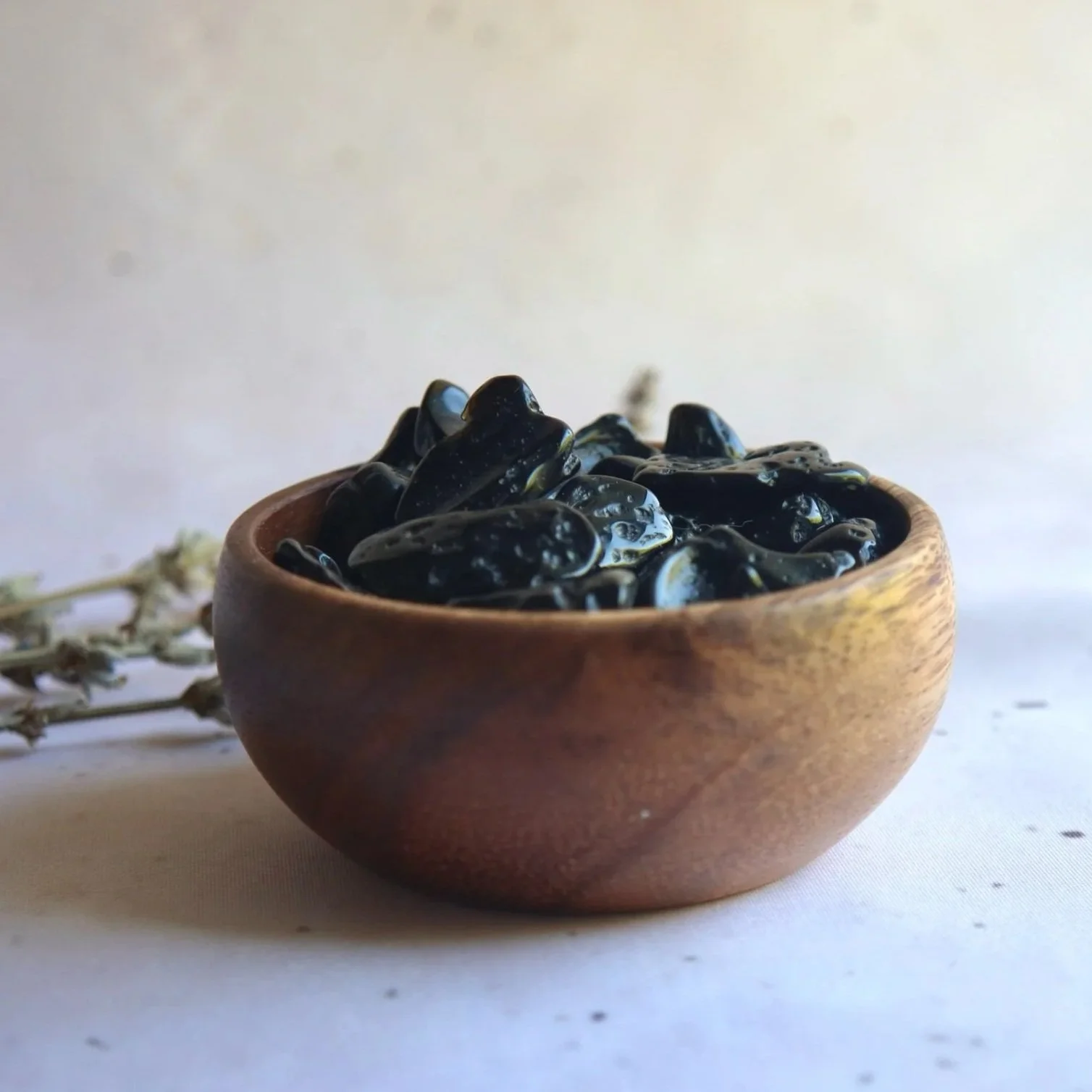 Natural Tektite tumble with dark glassy appearance