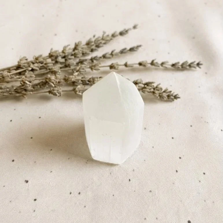 Polished Satin Spar tower, commonly known as Selenite, displaying natural fibrous chatoyancy and luminous sheen