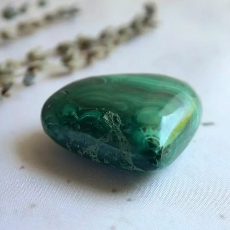 Malachite crystal heart approximately 4.5cm wide and 1cm thick