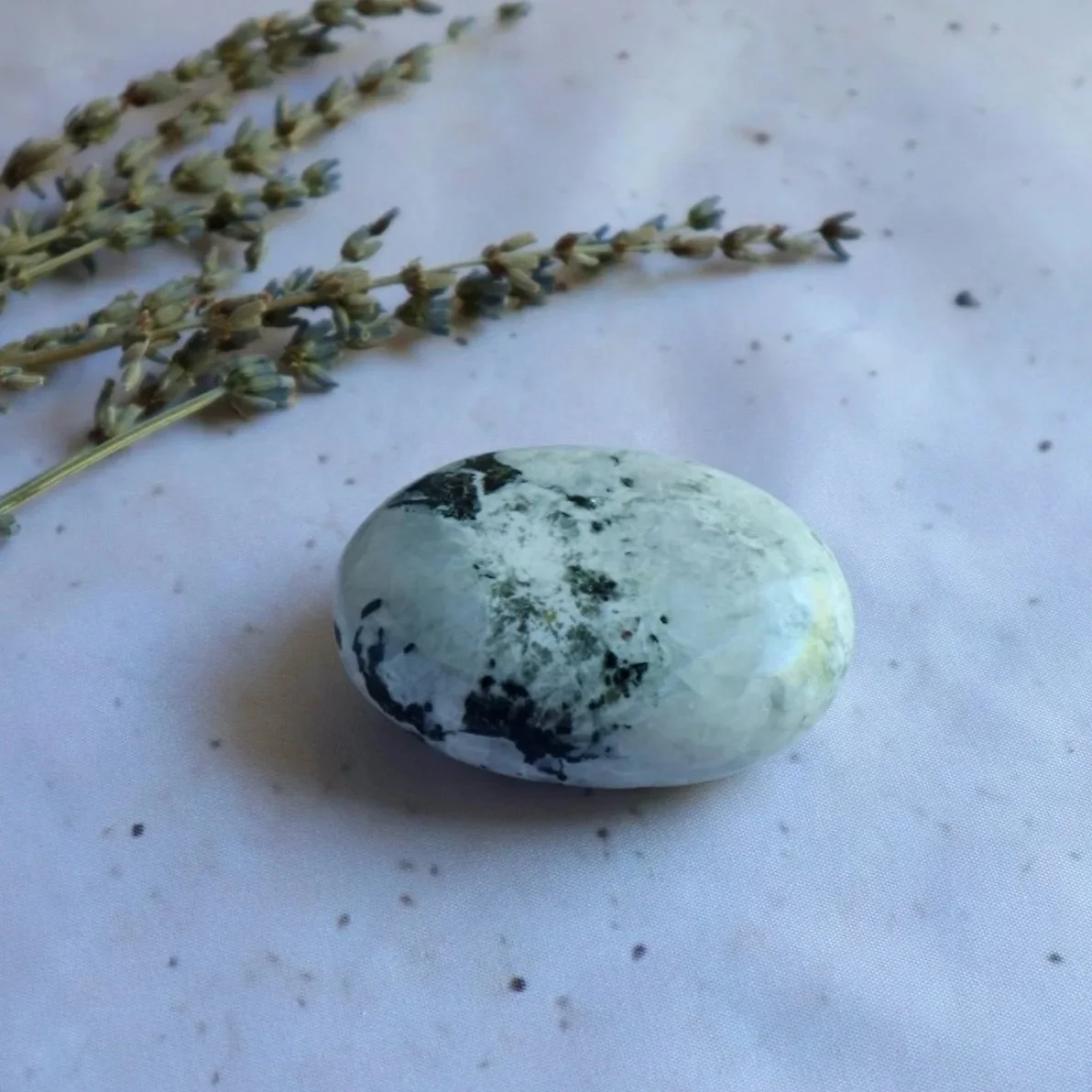 Exact Rainbow Moonstone palm stone measuring approximately 7 cm