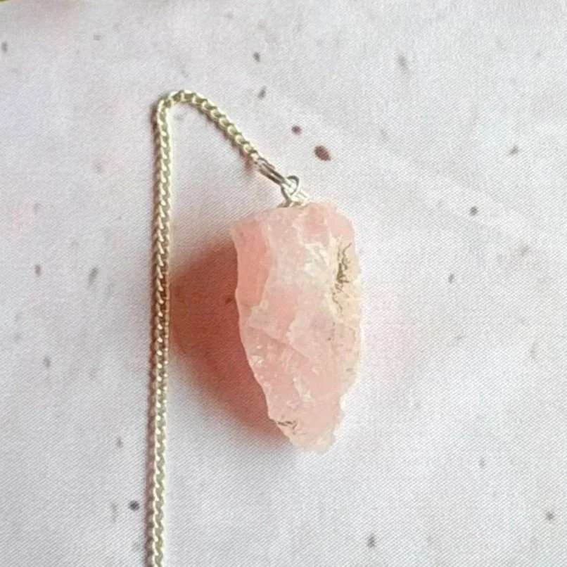 Natural Rose Quartz pendulum associated with love and emotional healing