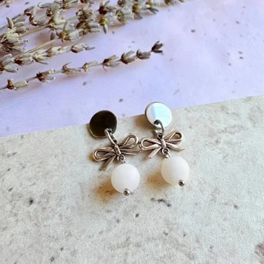 Natural matte Rose Quartz crystal earrings with stainless steel bow charms
