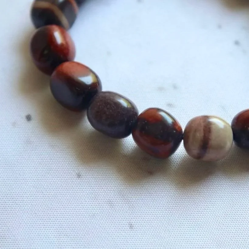 Close-up of the distinctive patterns and colours on Australian Print Stone bracelet beads.