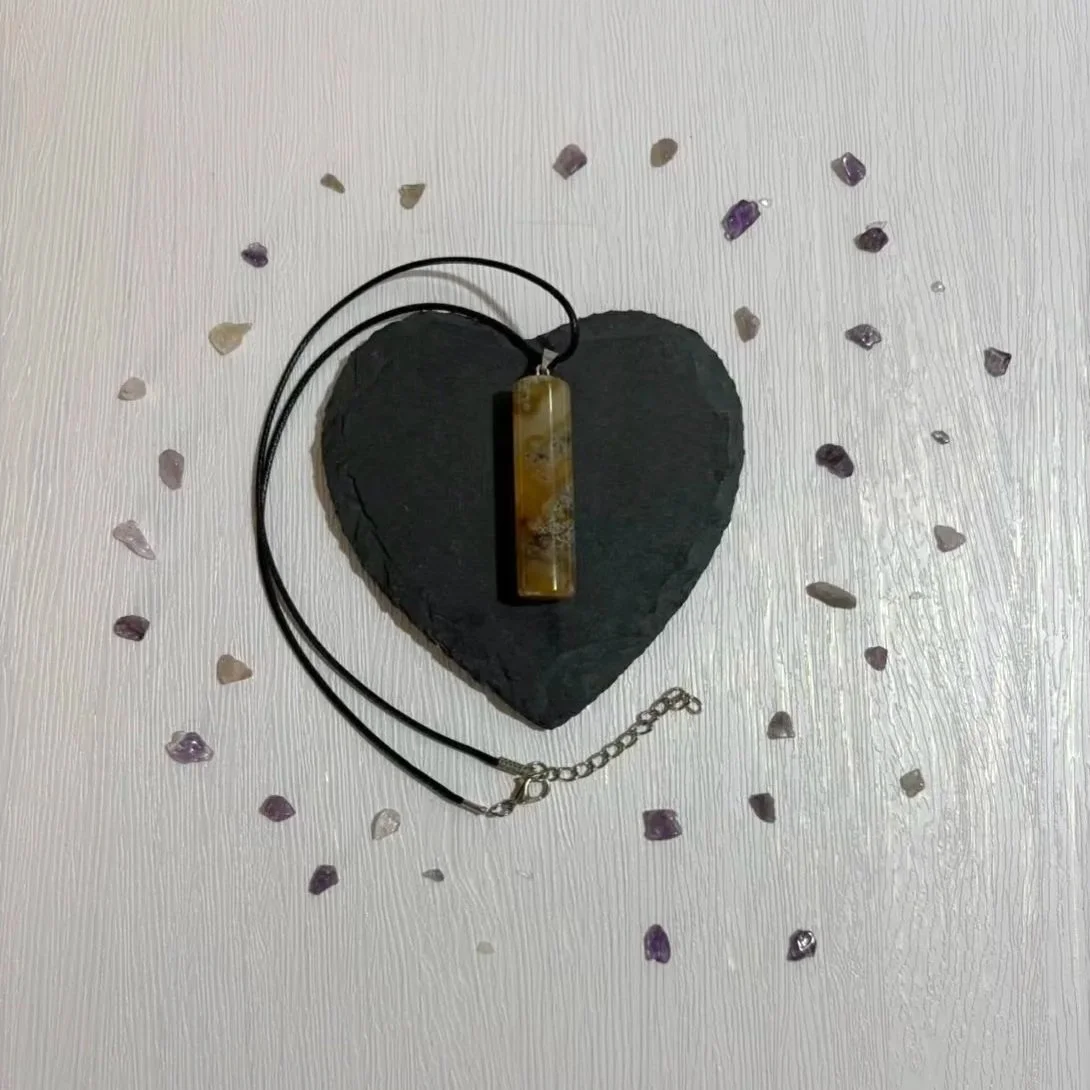 Crystal column necklace made of Fancy Jasper on neutral background