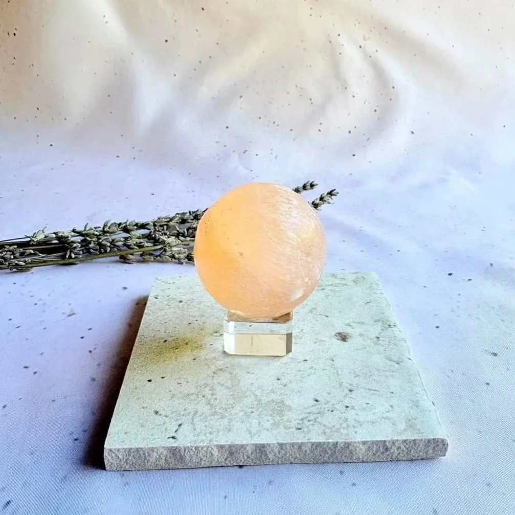 Natural Peach Satin Spar sphere with warm apricot colouring and fibrous crystal texture