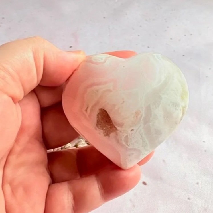 Polished Mangano Calcite crystal heart for self-love and emotional healing