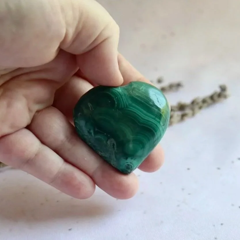Green Malachite heart showing its natural patterning and colour variations