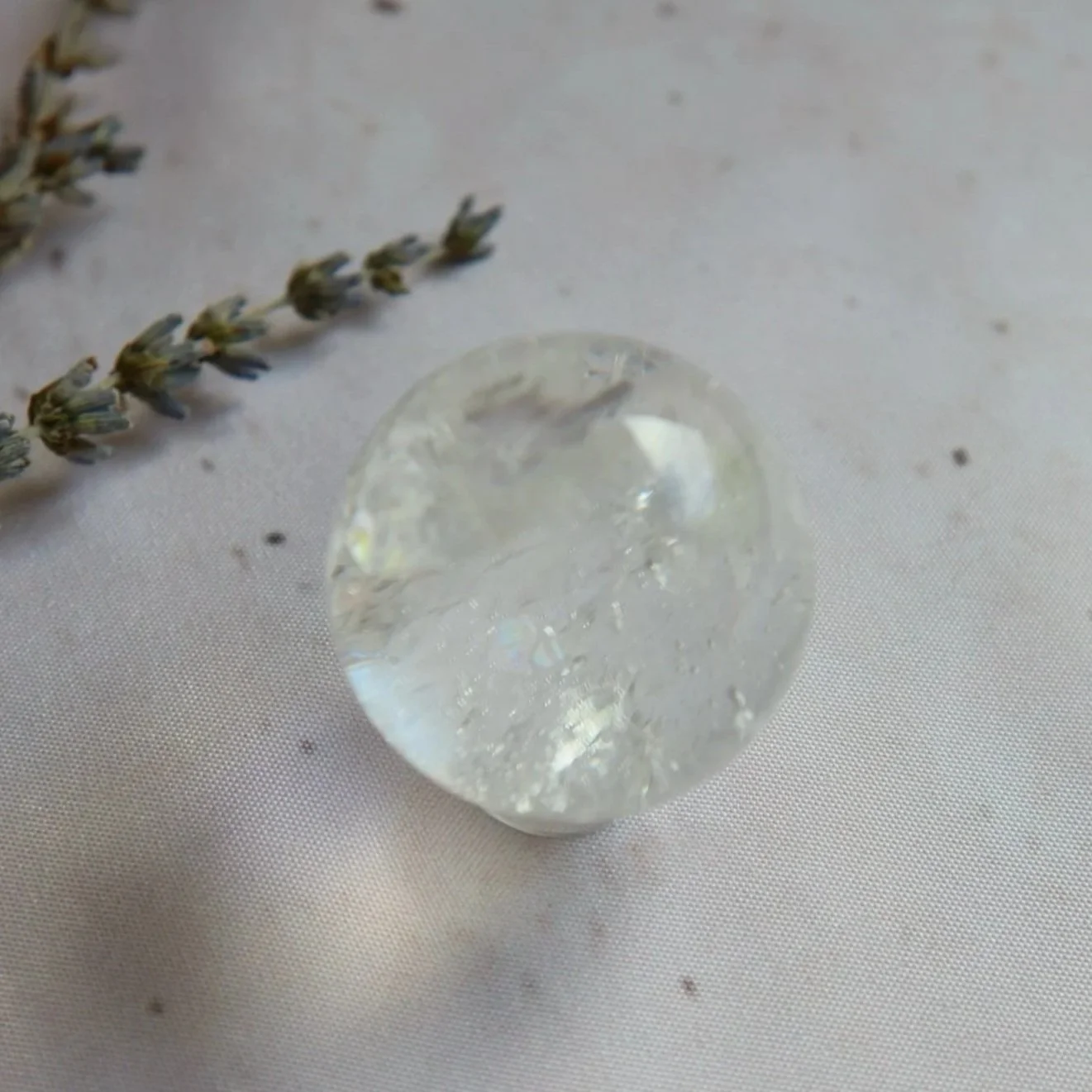 Clear Quartz crystal sphere with bright transparent colouring and natural inclusions