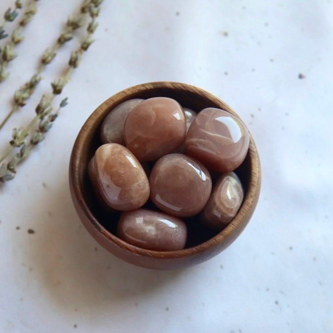 African Sunstone tumble with natural inclusions, colouring and shimmering surface