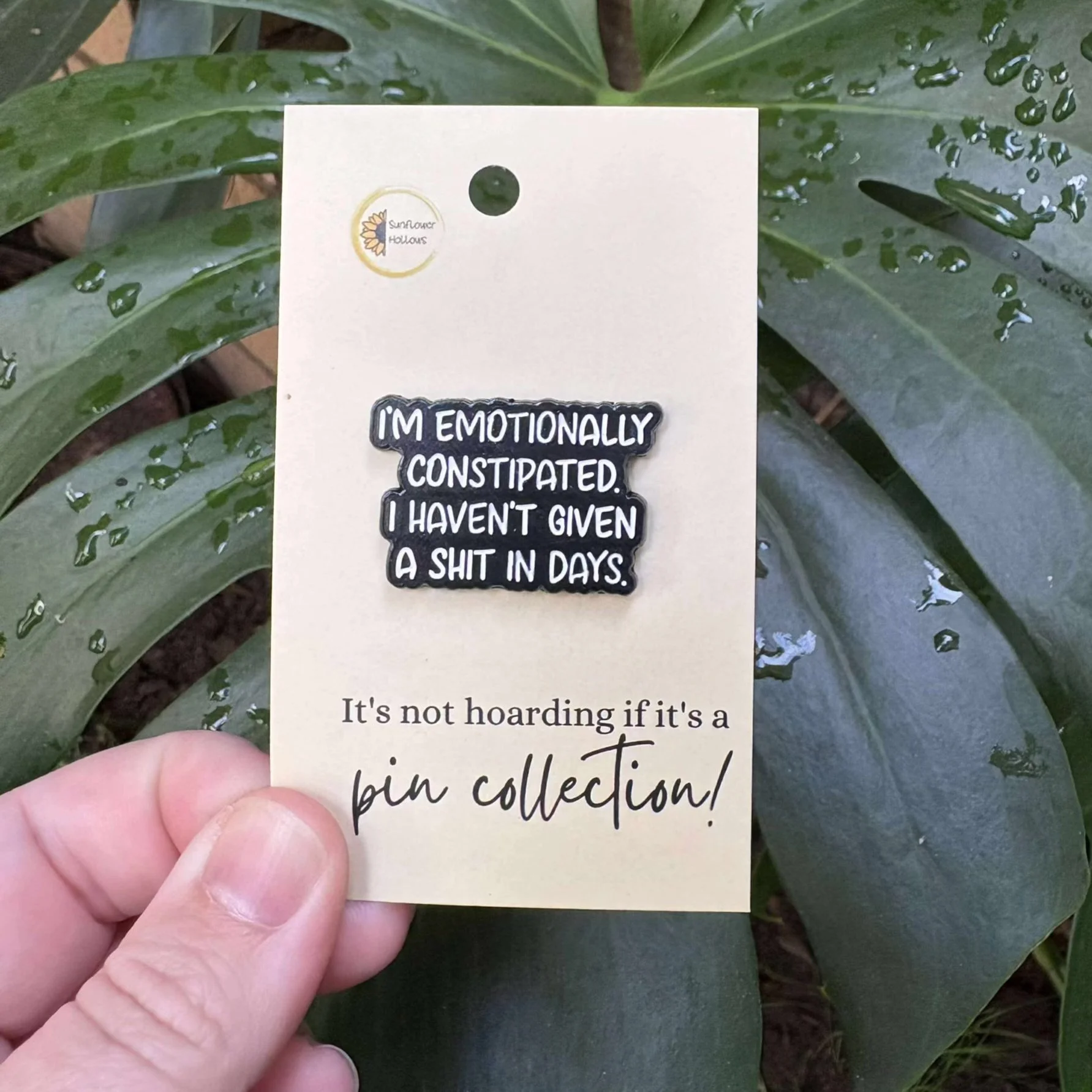 Enamel pin with the phrase “I’m emotionally constipated, I haven’t given a shit in days” — a funny, sarcastic mental health accessory