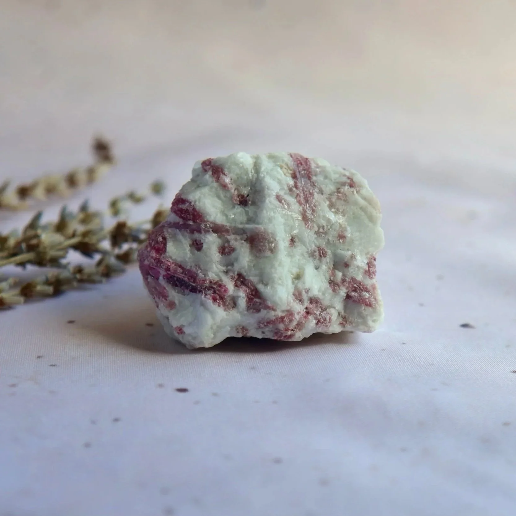 Exact Rubellite Tourmaline specimen measuring approximately 6 × 5 cm, with raspberry-pink markings against a contrasting white matrix.