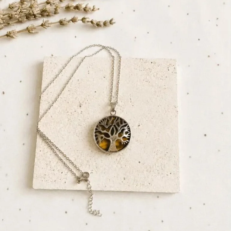 Tiger's Eye crystal necklace displaying golden-brown chatoyancy and Tree of Life design