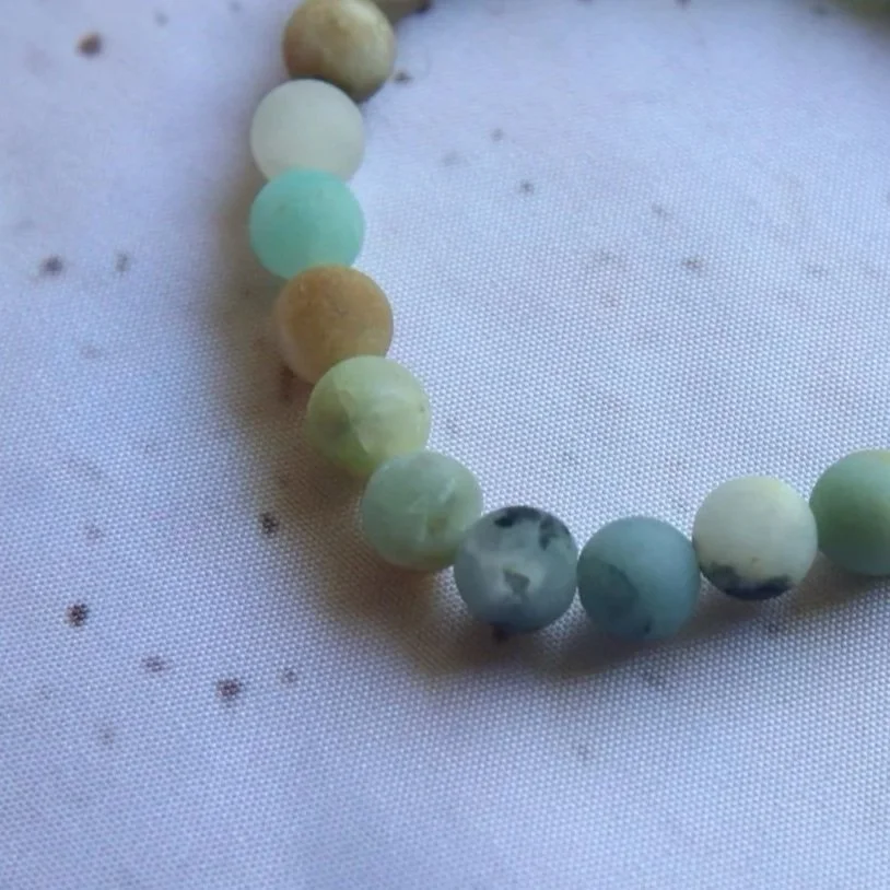 Close-up of natural green and blue tones in an Amazonite Matte Bracelet