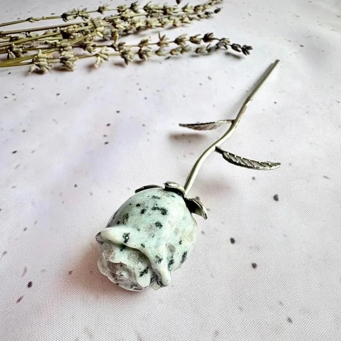 Kiwi Jasper rose featuring a silver coloured stem and natural green speckled crystal flower