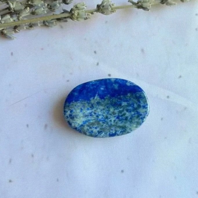 Natural Lapis Lazuli oval worry stone with polished finish and thumb indentation