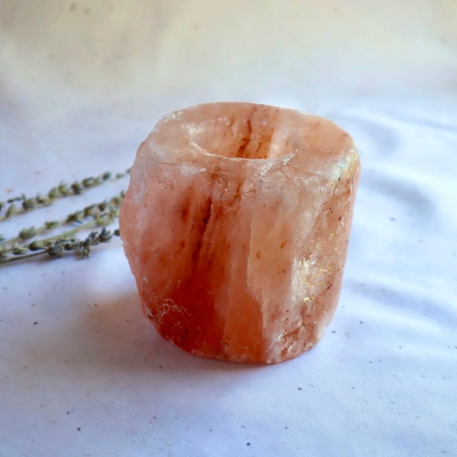Genuine Himalayan Salt candle holder designed to hold a standard tealight candle.