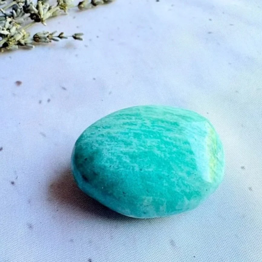Natural Amazonite crystal palm stone displaying green and blue tones