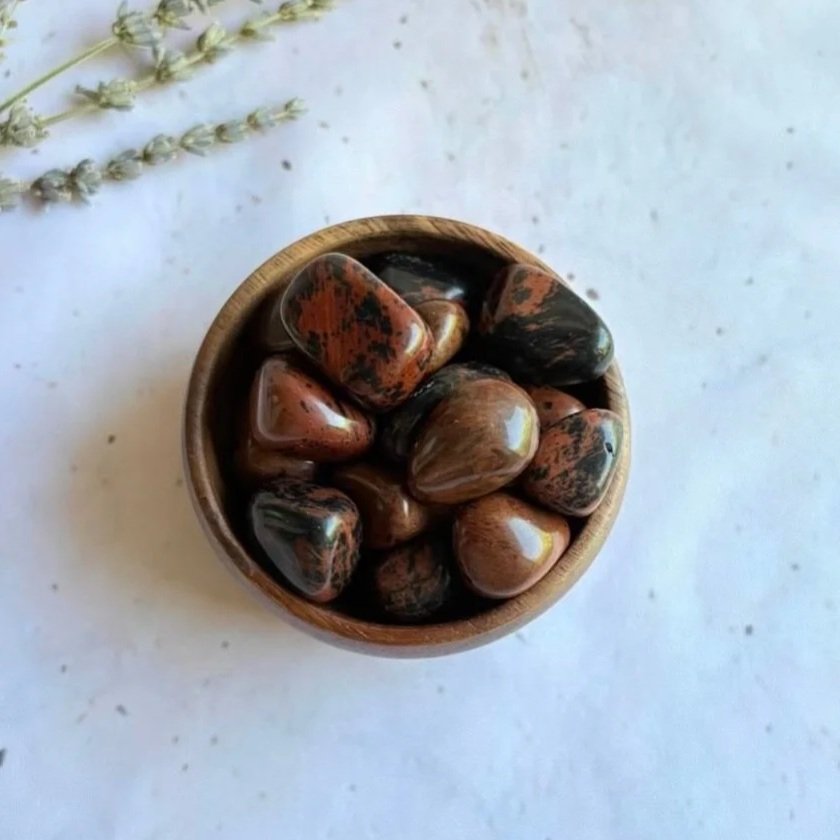 Mahogany Obsidian tumble associated with protection, grounding, confidence, and resilience