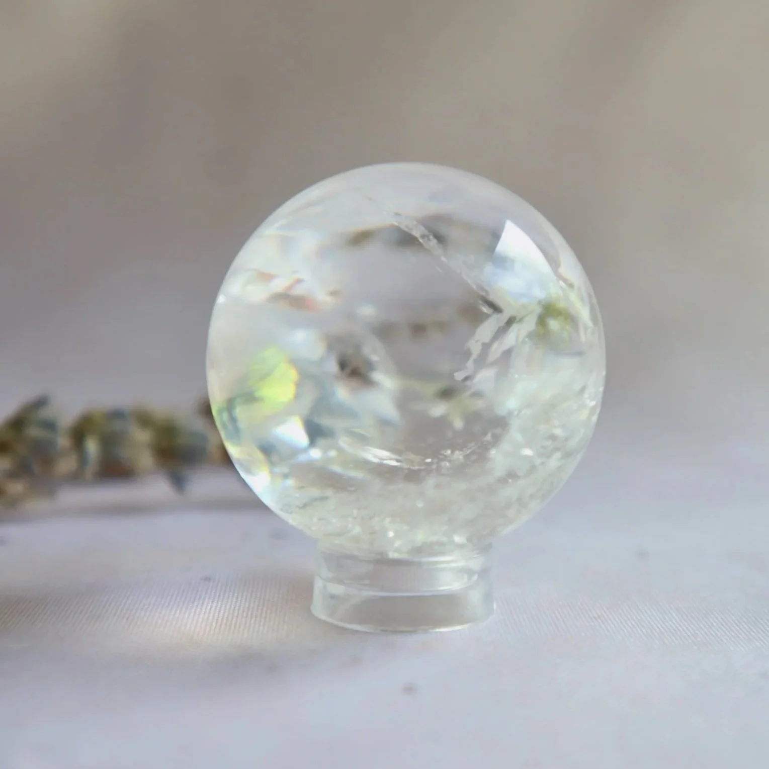 Clear Quartz crystal sphere with naturally transparent quartz and subtle internal inclusions