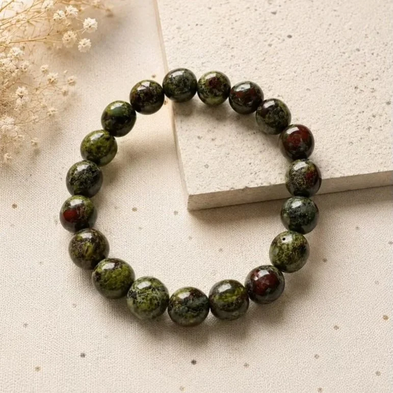 Natural Kambaba Jasper tumble bead bracelet featuring green and black patterned gemstone beads on a stretch elastic band.