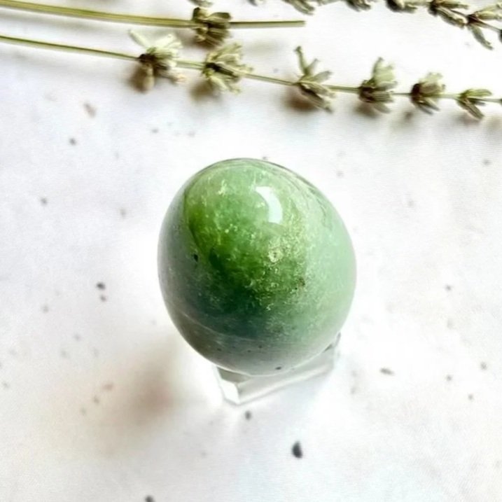 Polished Green Aventurine egg displayed as a crystal collection piece